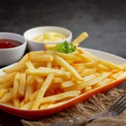 Crispy French fries with ketchup and mayonnaise.