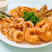 deep fried seafood (shrimps and squid) with mix vegetable - unhealthy food style