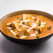 Paneer Butter Masala or Cheese Cottage Curry, popular Indian Lunch/Dinner menu  served in a ceramic bowl, selective focus