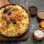 side-close-up-view-spices-pilaf-board-bowls-colorful-spices