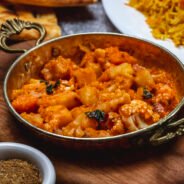 side view vegetable ragout with potato carrot and cauliflower and basil