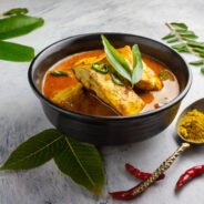 Spicy Fish curry_Seer fish curry ,traditional Indian fish curry, white background